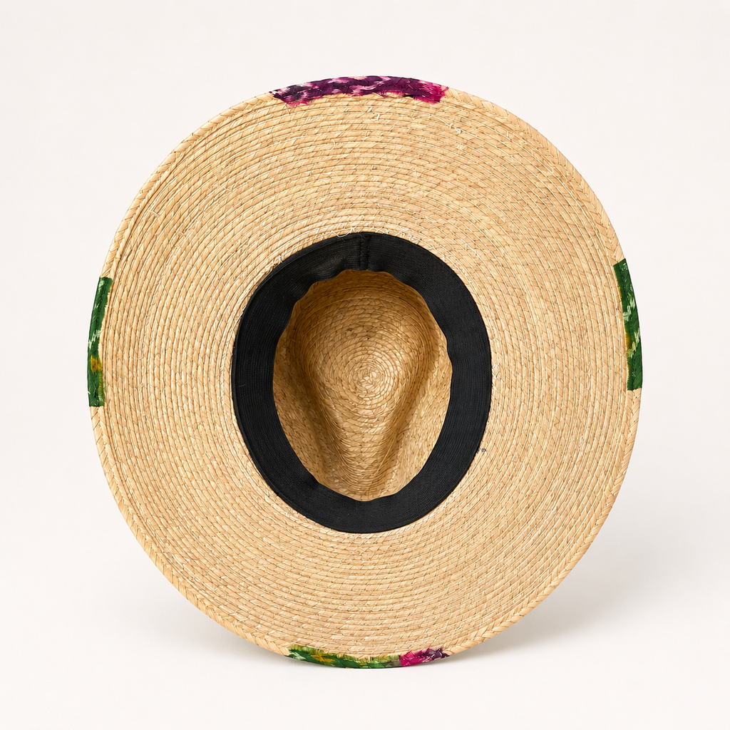 Interior view showing the dark inner head opening and woven underside of the straw hat.