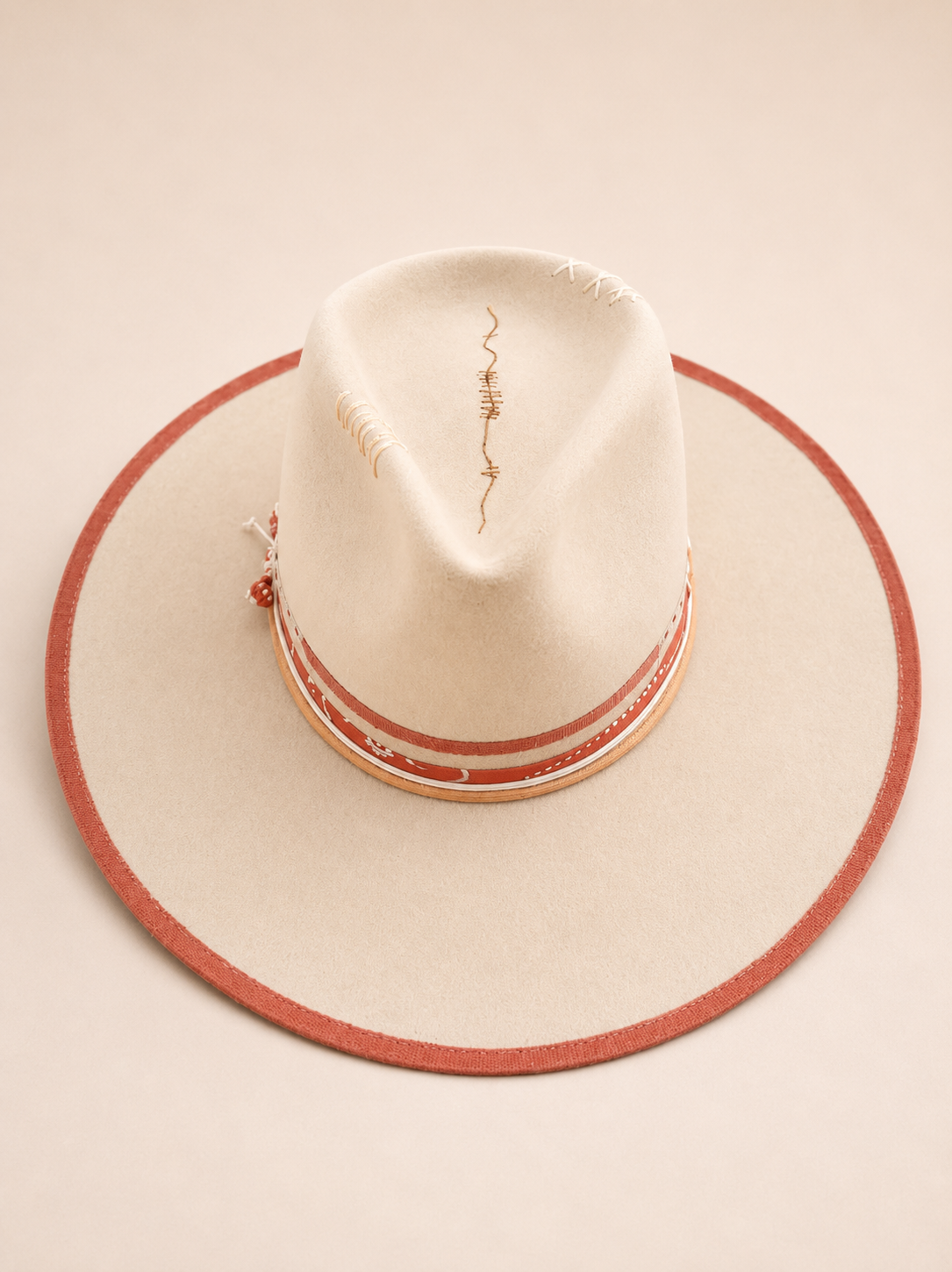 Bohemian Atelier bespoke fedora with distressed patina, bandana wrap, and symbolic accents