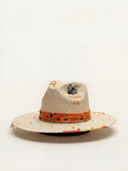 Decorative hat with colorful band and text on a white background